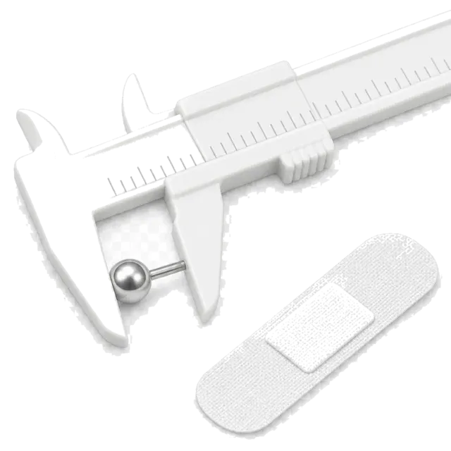 Caliper measuring a stud beside a plaster